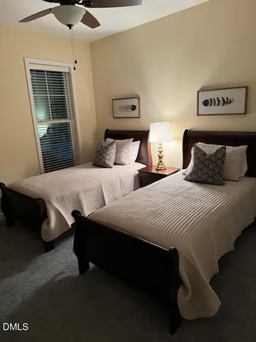 a bedroom with double bed and a window