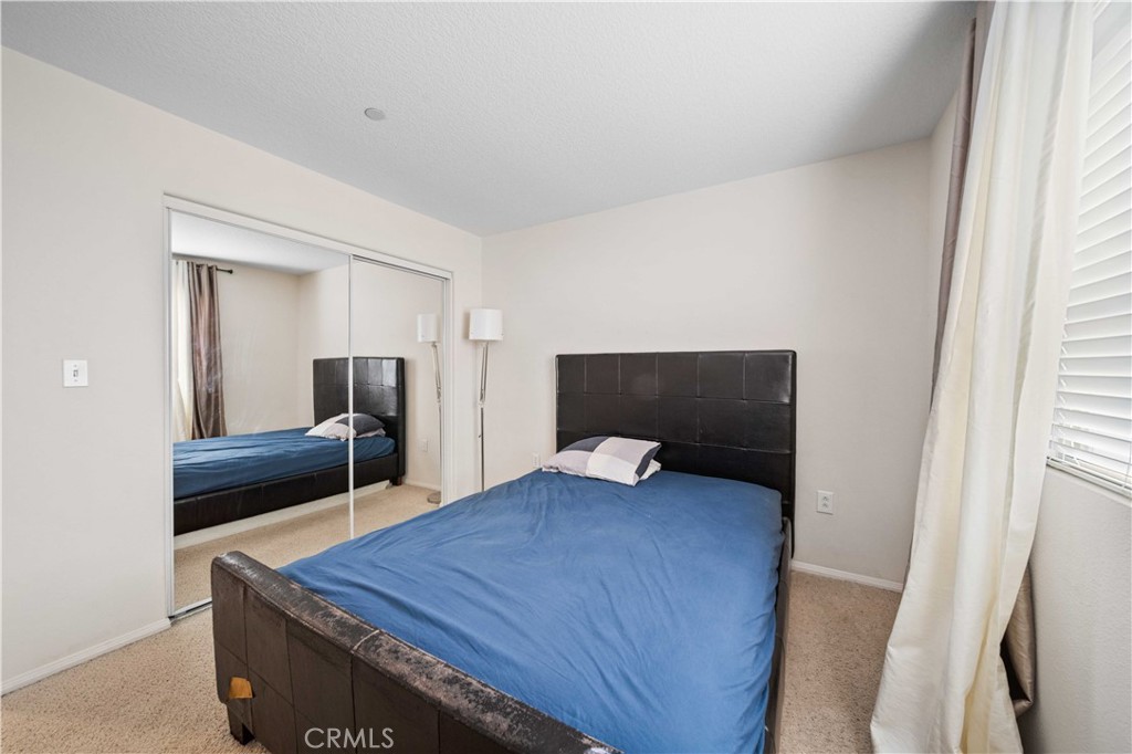 9352 Condor Court Pacoima, CA 91331 - Photo 12 of 23 a bedroom with a bed and a dresser