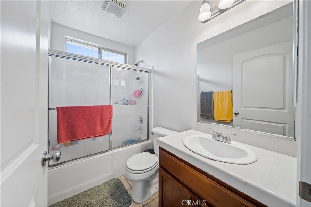 9352 Condor Court Pacoima, CA 91331 - Photo 13 of 23 a bathroom with a sink toilet and shower