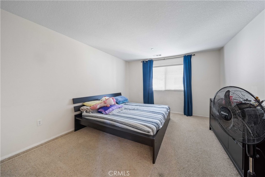 9352 Condor Court Pacoima, CA 91331 - Photo 15 of 23 a bedroom with a bed and with a window