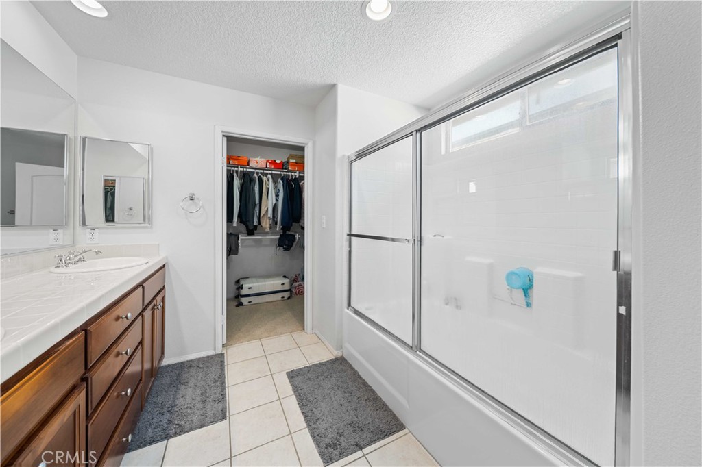 9352 Condor Court Pacoima, CA 91331 - Photo 17 of 23 a bathroom with a shower and a sink