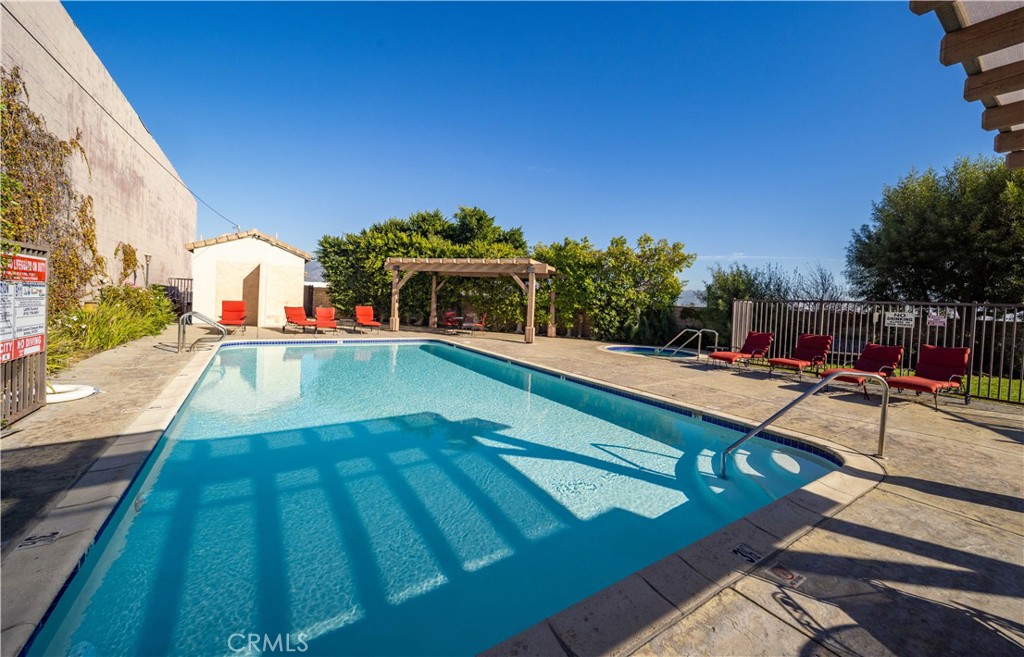 9352 Condor Court Pacoima, CA 91331 - Photo 21 of 23 a view of a swimming pool with an outdoor seating