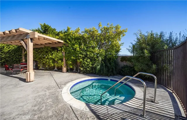 a view of a backyard with sitting area