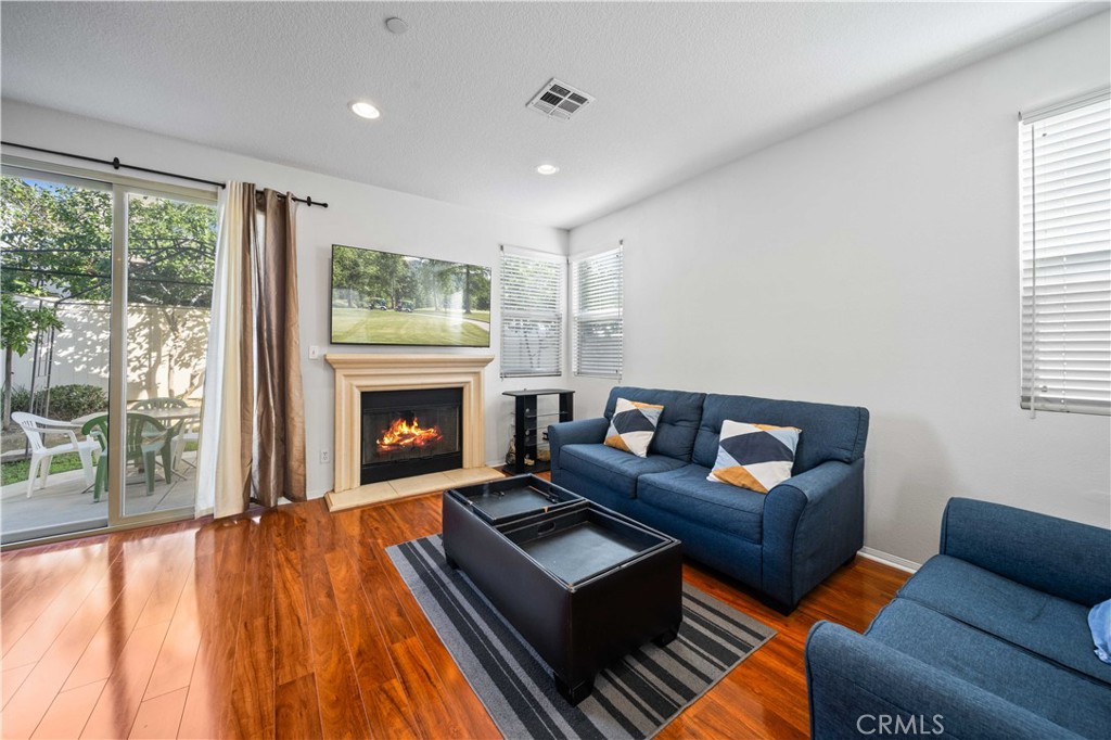 9352 Condor Court Pacoima, CA 91331 - Photo 5 of 23 a living room with furniture and a fireplace