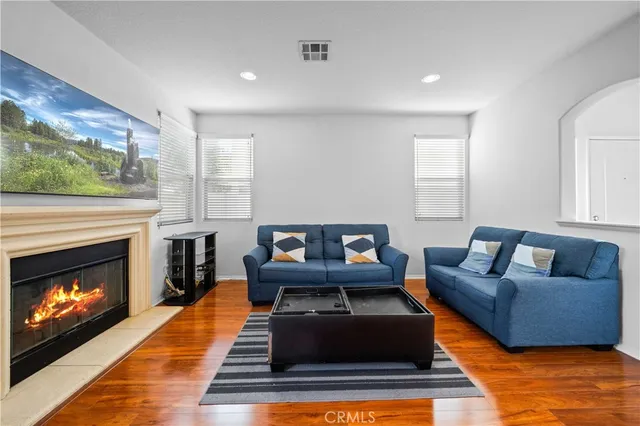 a living room with furniture and a fireplace