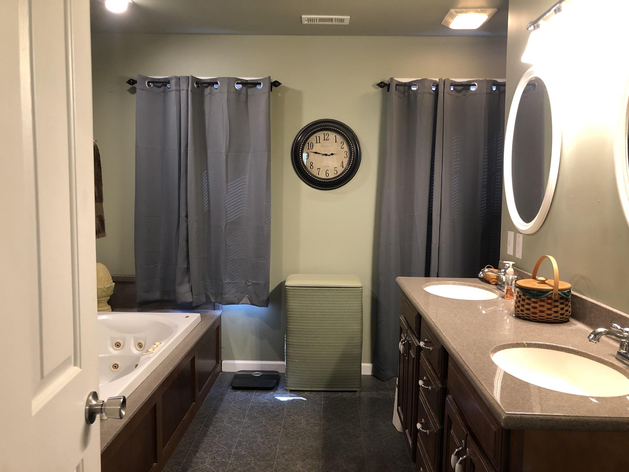 3046 Wayside Road Manchester, TN 37355 - Photo 15 of 30 a bathroom with a sink and a mirror