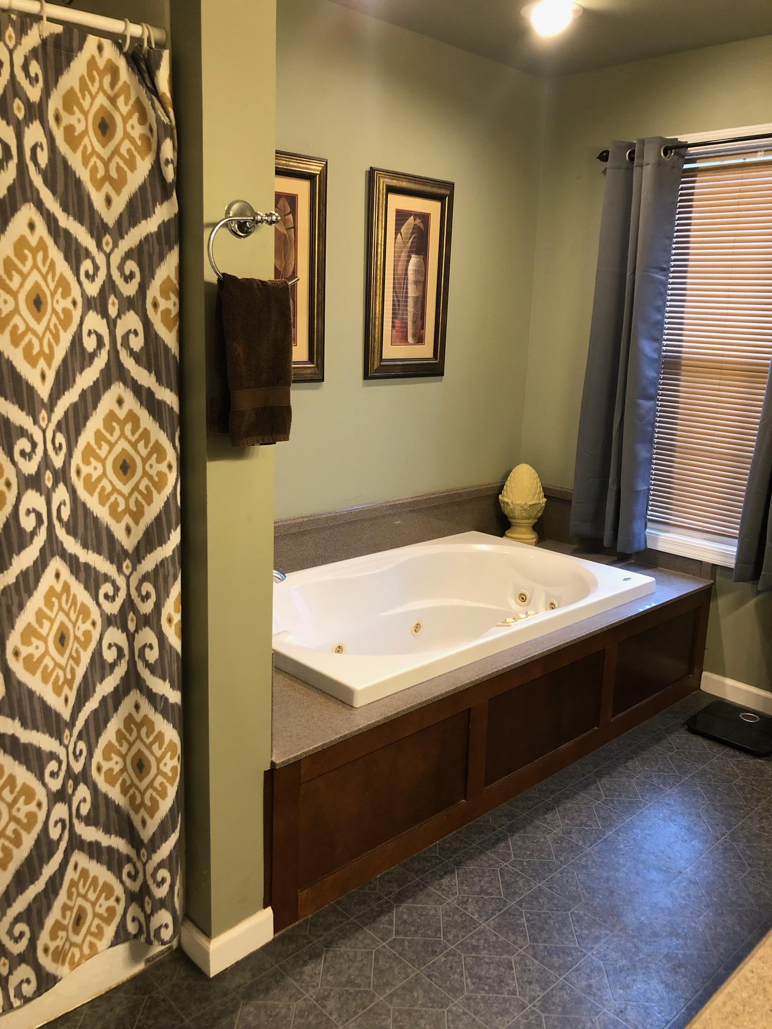 3046 Wayside Road Manchester, TN 37355 - Photo 16 of 30 a bathroom with a bathtub and shower