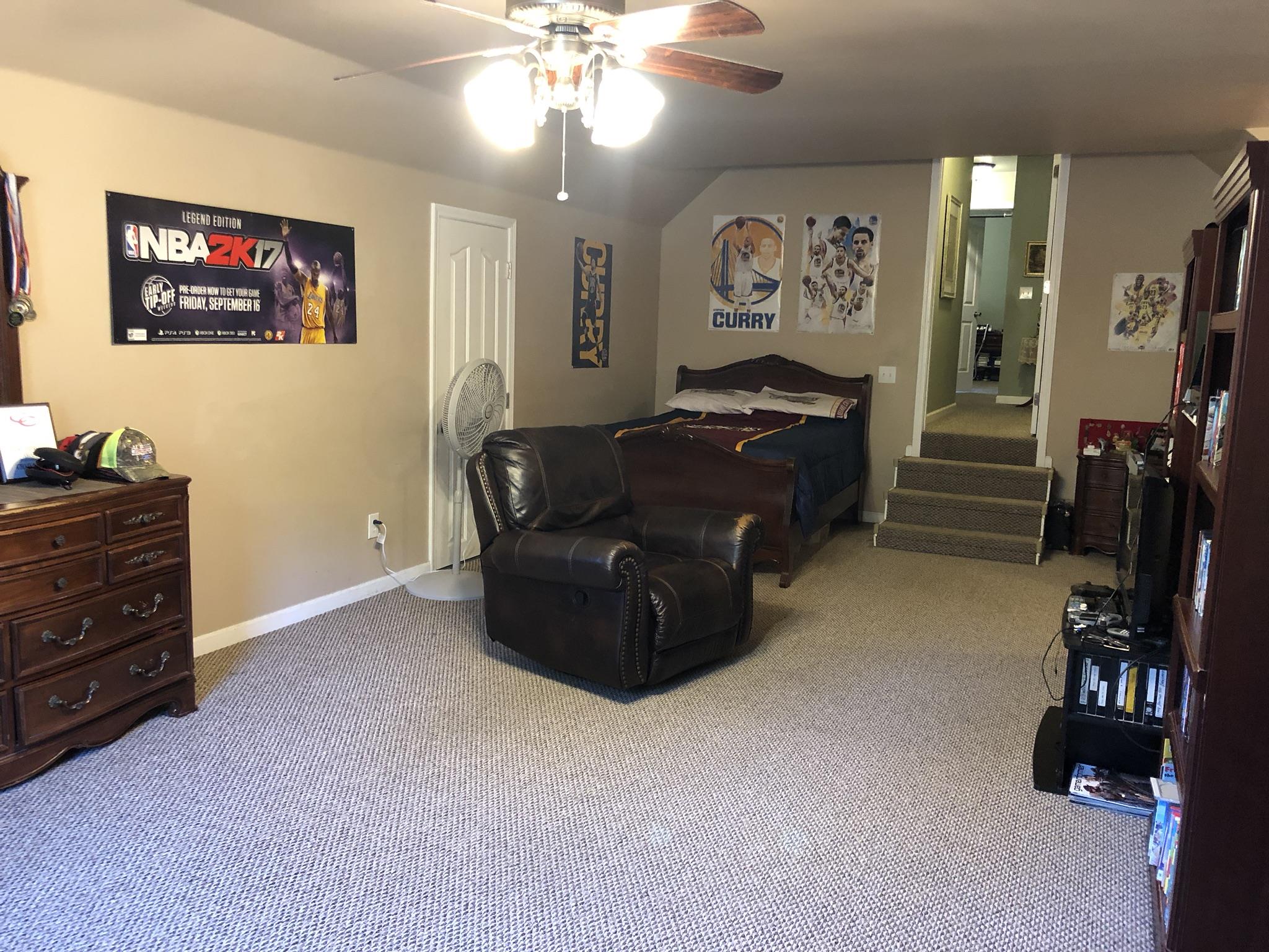 3046 Wayside Road Manchester, TN 37355 - Photo 21 of 30 a living room with furniture and a chandelier