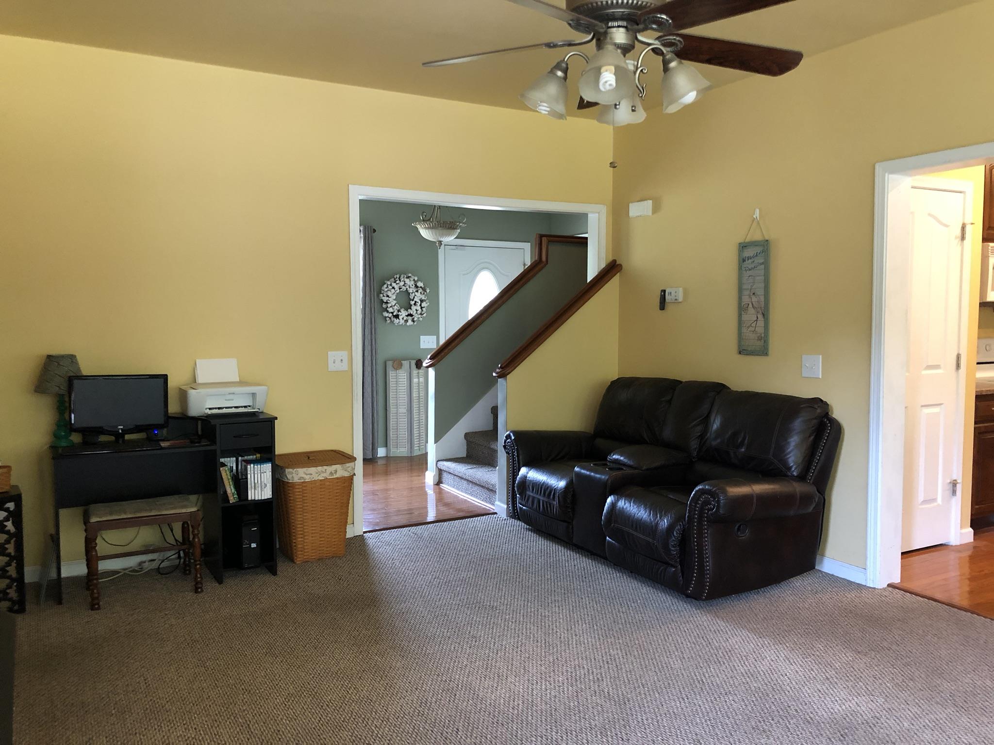 3046 Wayside Road Manchester, TN 37355 - Photo 5 of 30 a living room with furniture and a chandelier
