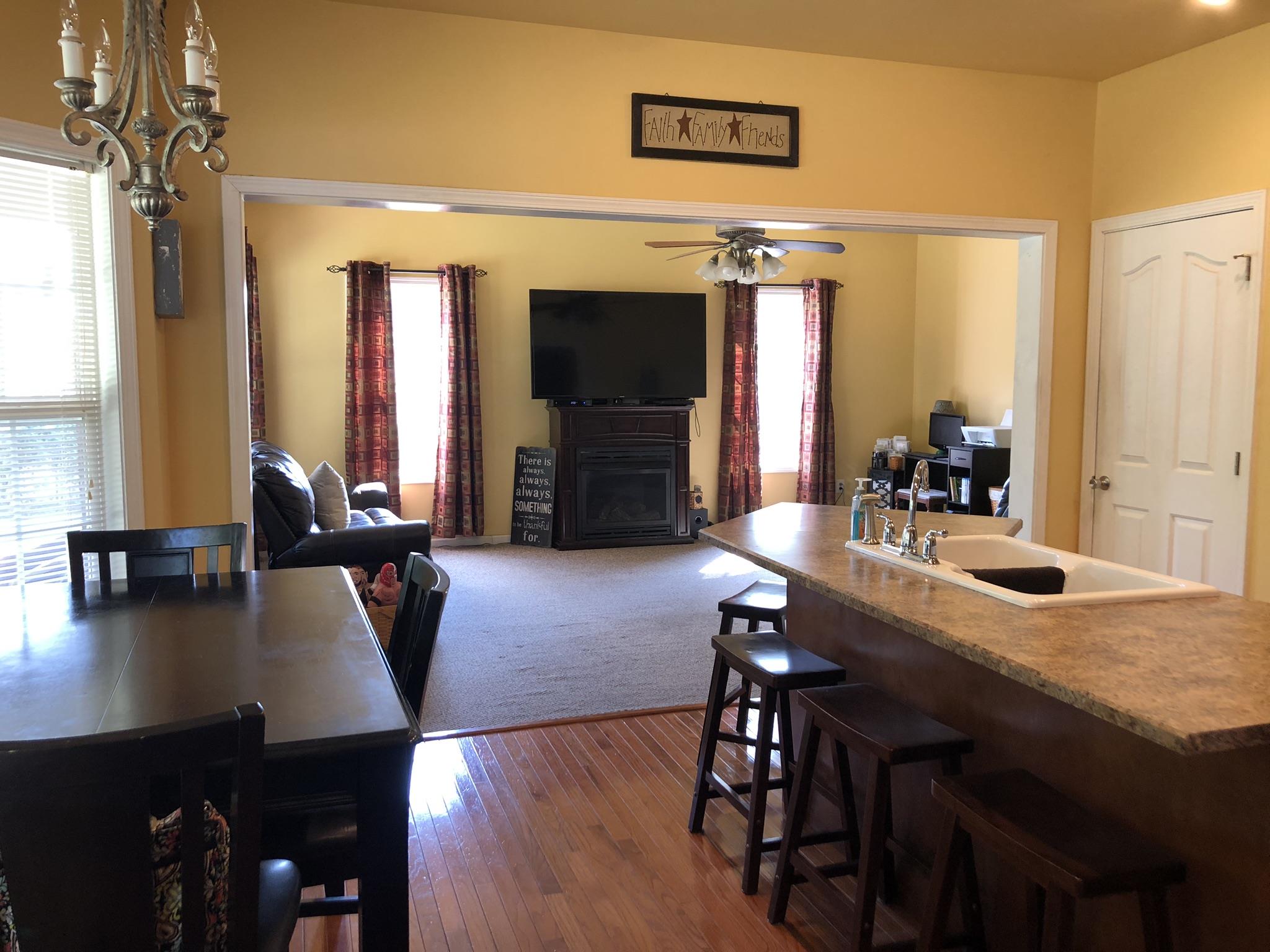 3046 Wayside Road Manchester, TN 37355 - Photo 7 of 30 a view of a dining room with furniture window and wooden floor