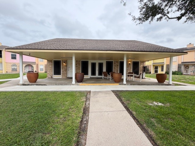 6702 Everhart Road, Unit A107 Corpus Christi, TX 78413 - Photo 12 of 13 a view of a building with a garden area