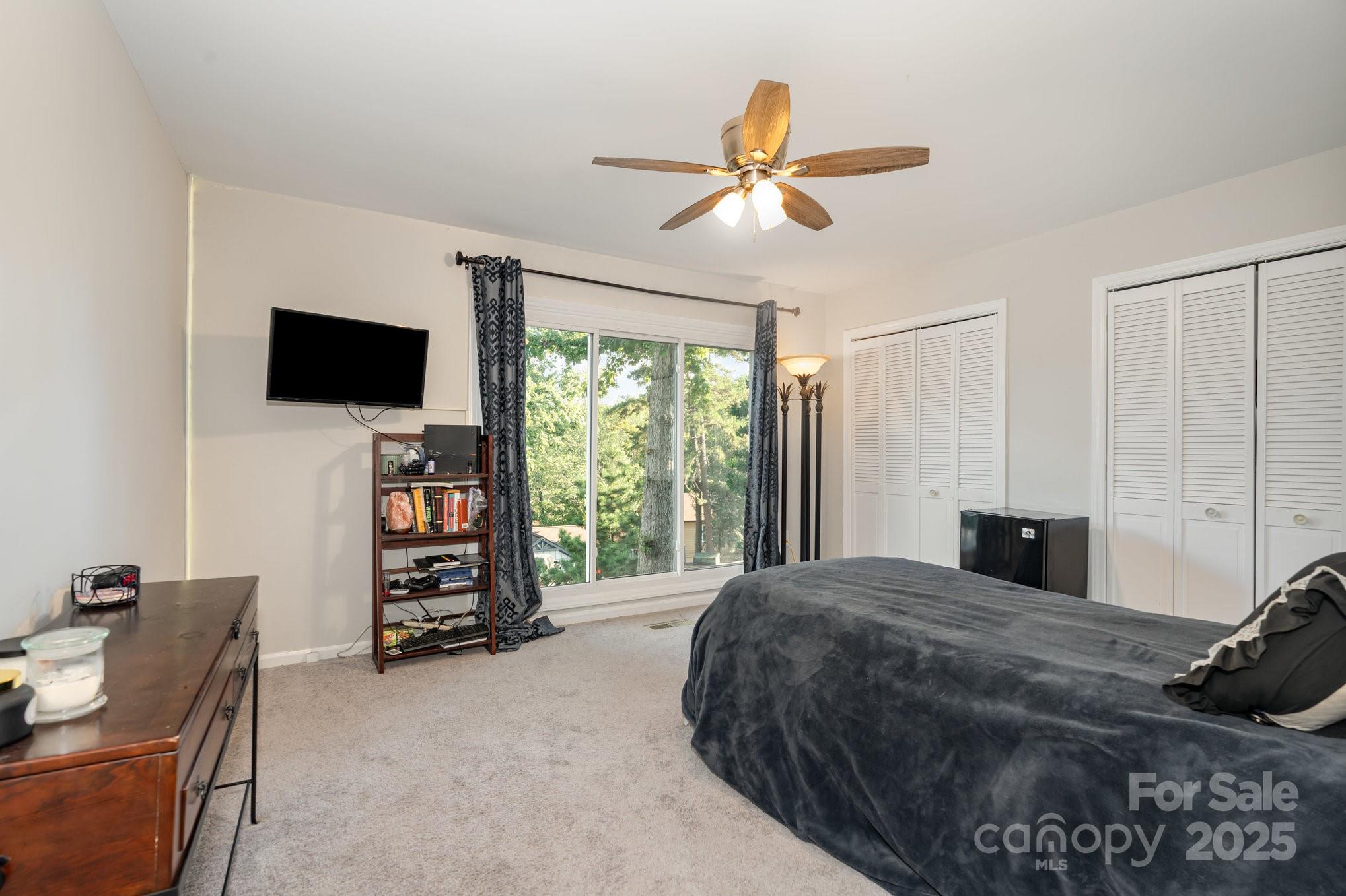 7042 Chelsea Day Lane Tega Cay, SC 29708 - Photo 20 of 40 a bedroom with a bed and a television