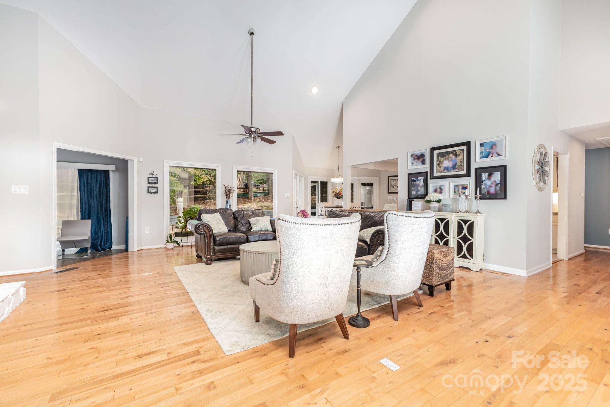 7042 Chelsea Day Lane Tega Cay, SC 29708 - Photo 2 of 40 a living room with furniture a rug and white walls