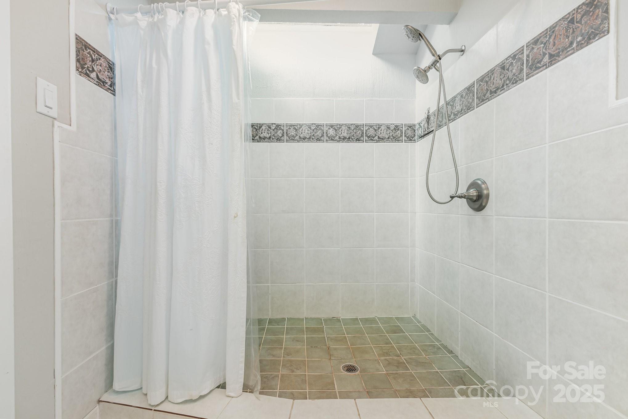 7042 Chelsea Day Lane Tega Cay, SC 29708 - Photo 23 of 40 a bathroom with a shower