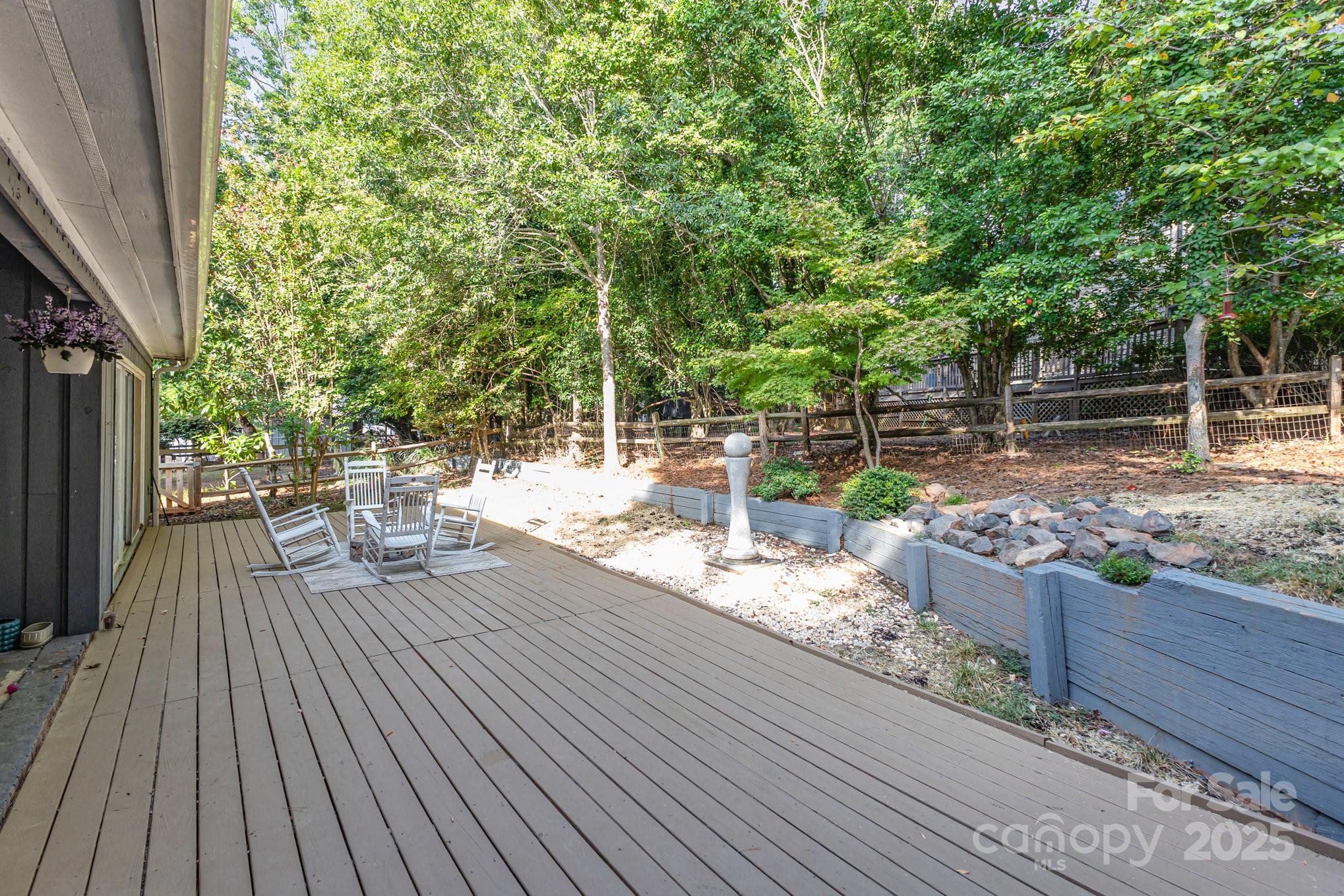 7042 Chelsea Day Lane Tega Cay, SC 29708 - Photo 25 of 40 a view of a deck with chairs and wooden floor