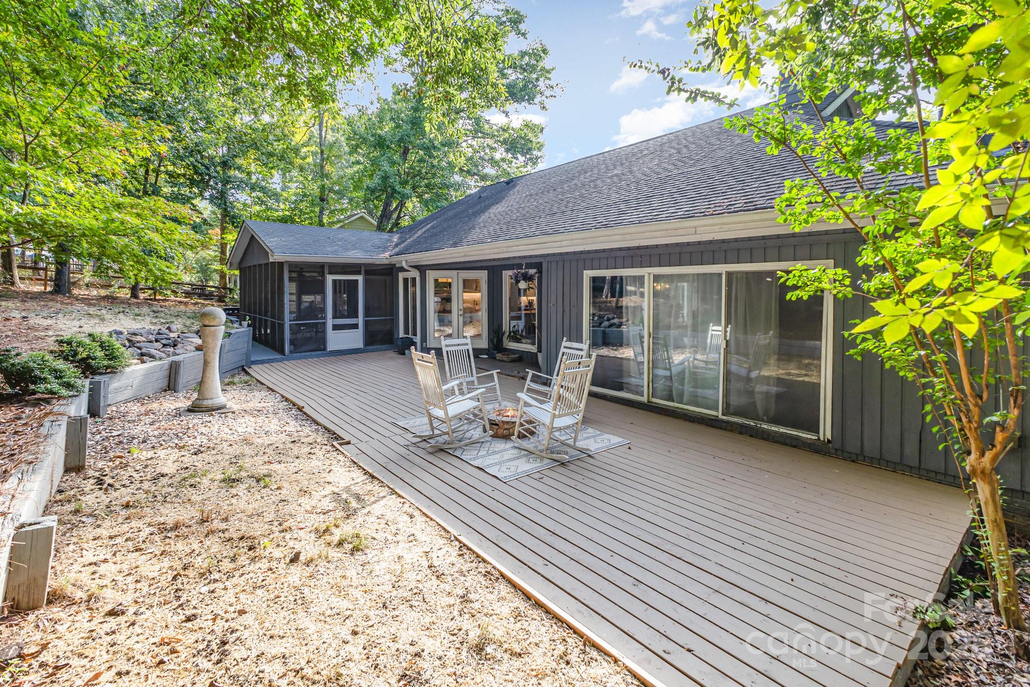 7042 Chelsea Day Lane Tega Cay, SC 29708 - Photo 26 of 40 a view of house with backyard outdoor seating and green space