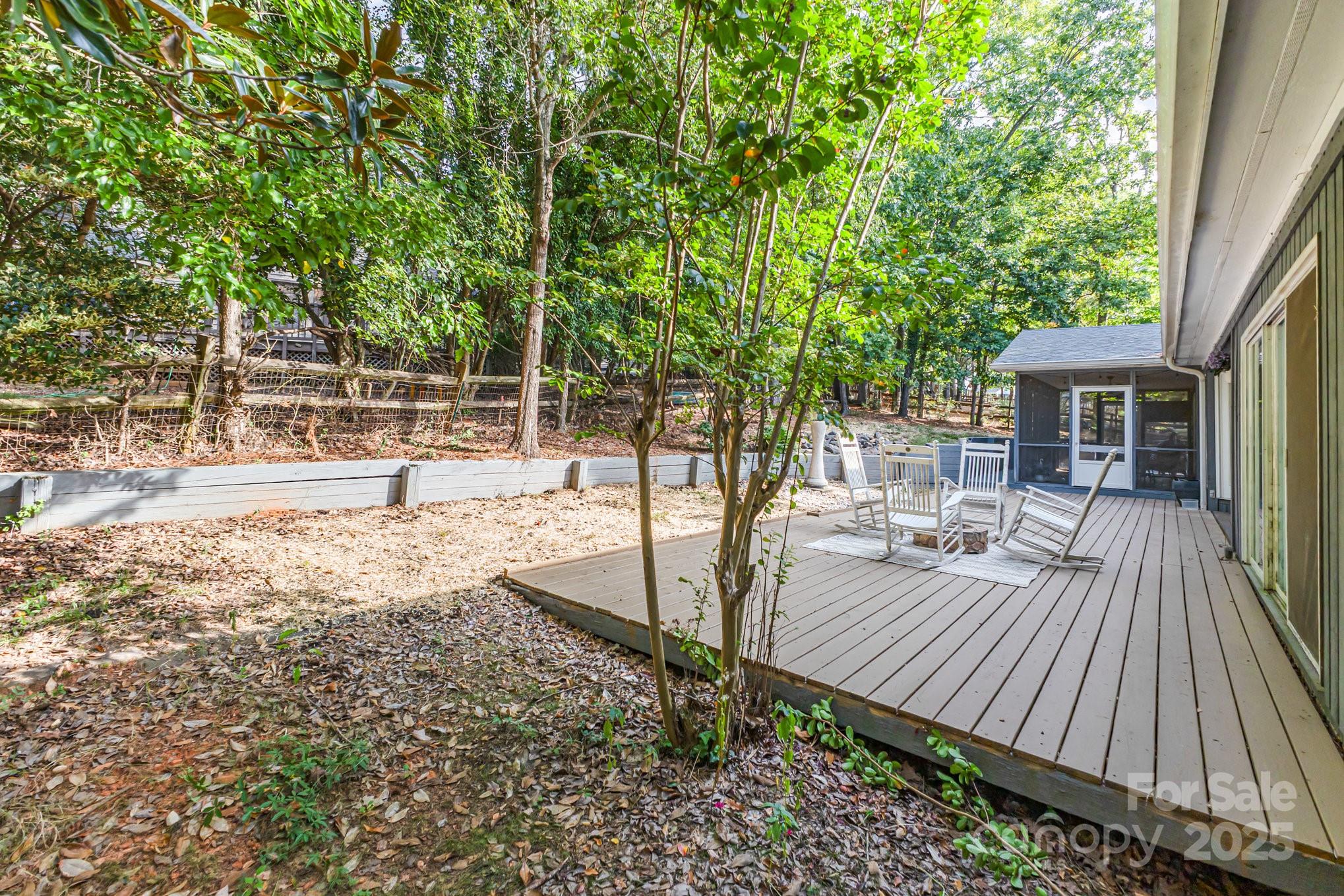 7042 Chelsea Day Lane Tega Cay, SC 29708 - Photo 27 of 40 a view of a backyard with sitting area