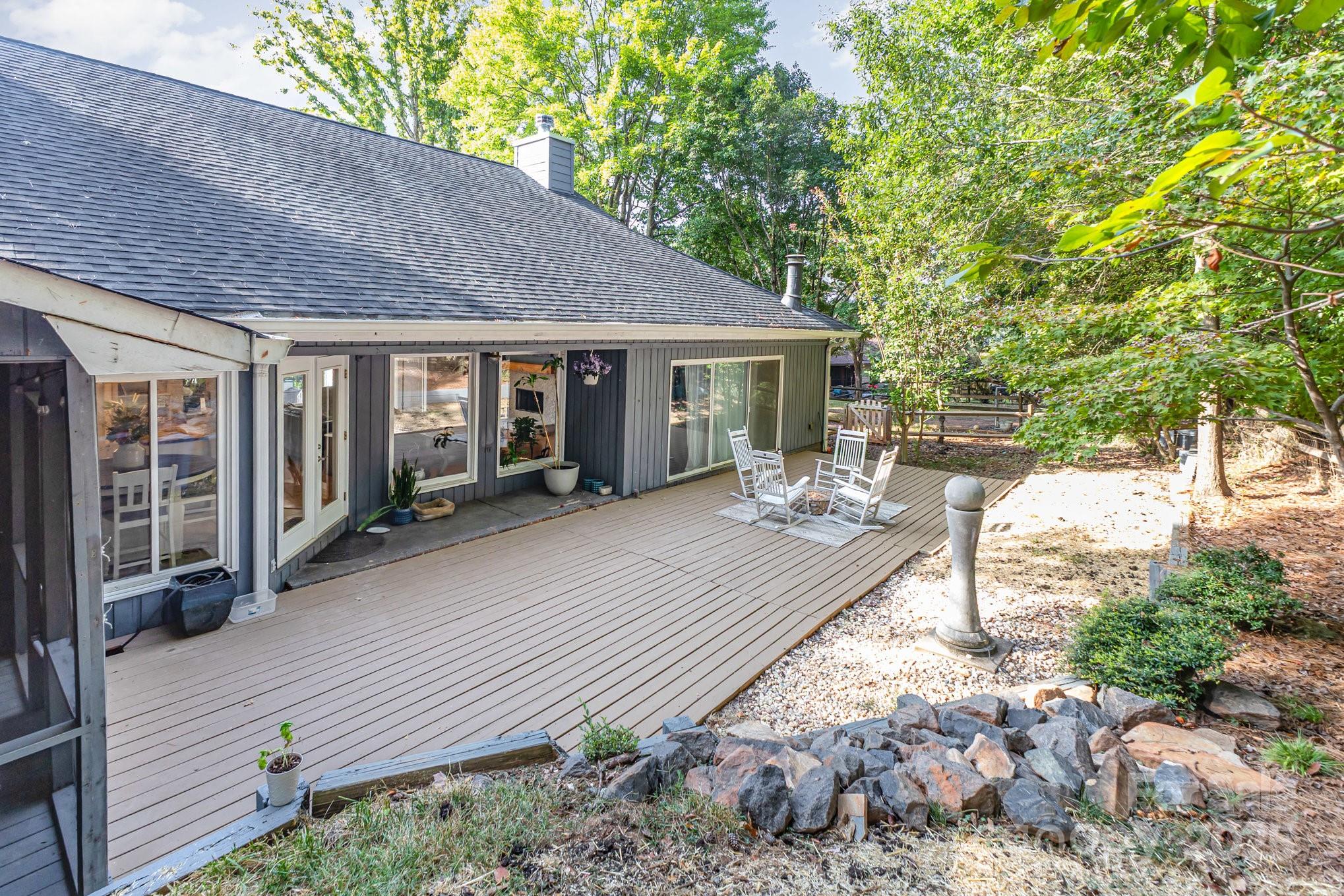 7042 Chelsea Day Lane Tega Cay, SC 29708 - Photo 28 of 40 a view of a house with backyard and sitting area
