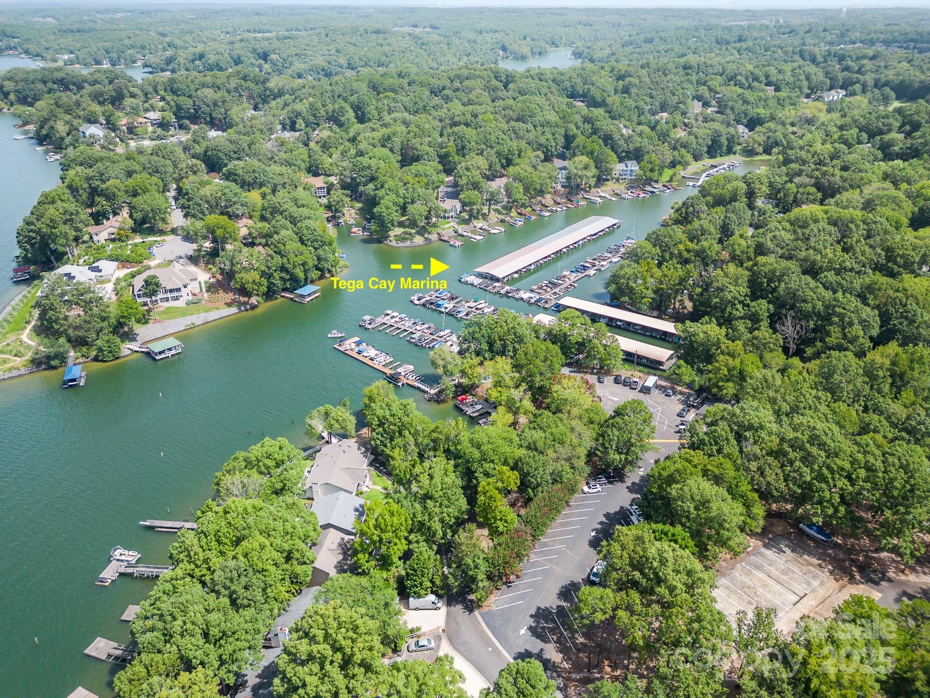 7042 Chelsea Day Lane Tega Cay, SC 29708 - Photo 34 of 40 an aerial view of lake residential house with outdoor space and trees all around