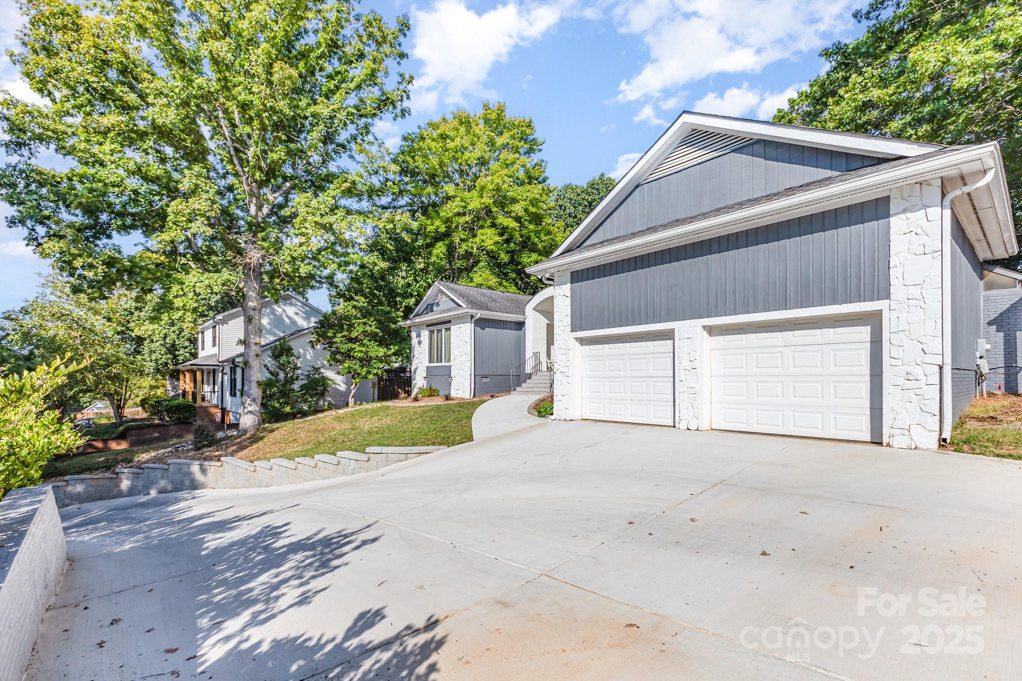 7042 Chelsea Day Lane Tega Cay, SC 29708 - Photo 36 of 40 a view of a house with a yard and garage