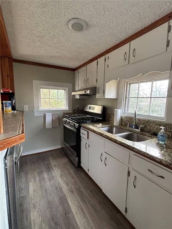332 Carr Street Athens, GA 30605 - Photo 5 of 8 a kitchen with granite countertop a sink cabinets stainless steel appliances and window