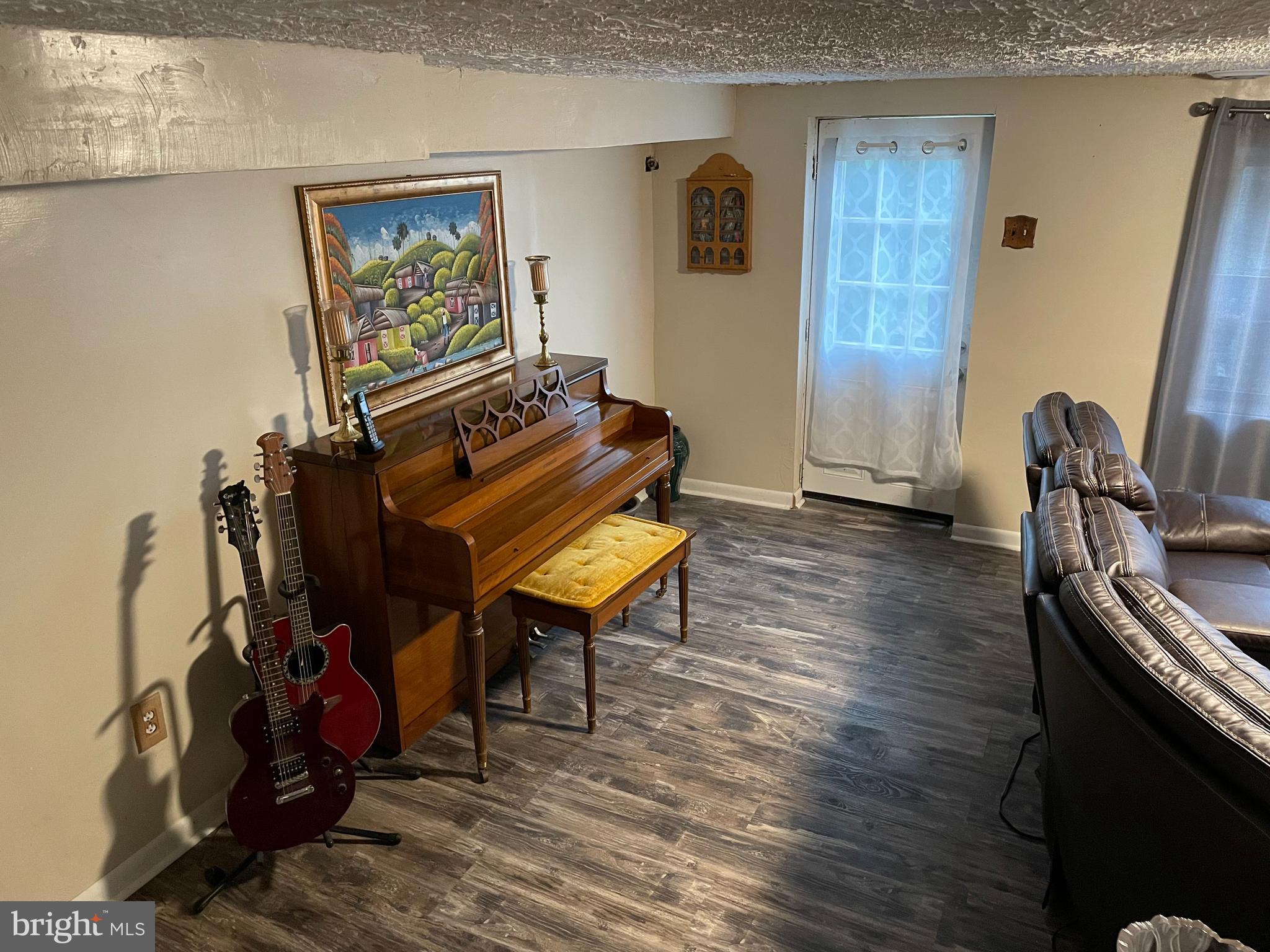 12133 Medford Road Philadelphia, PA 19154 - Photo 22 of 26 a living room with furniture and a wooden floor