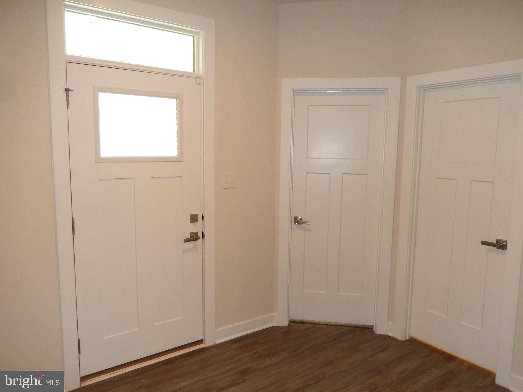 36884 Red Cedar Loop Ocean View, DE 19970 - Photo 6 of 50 a view of an empty room with wooden floor and a window