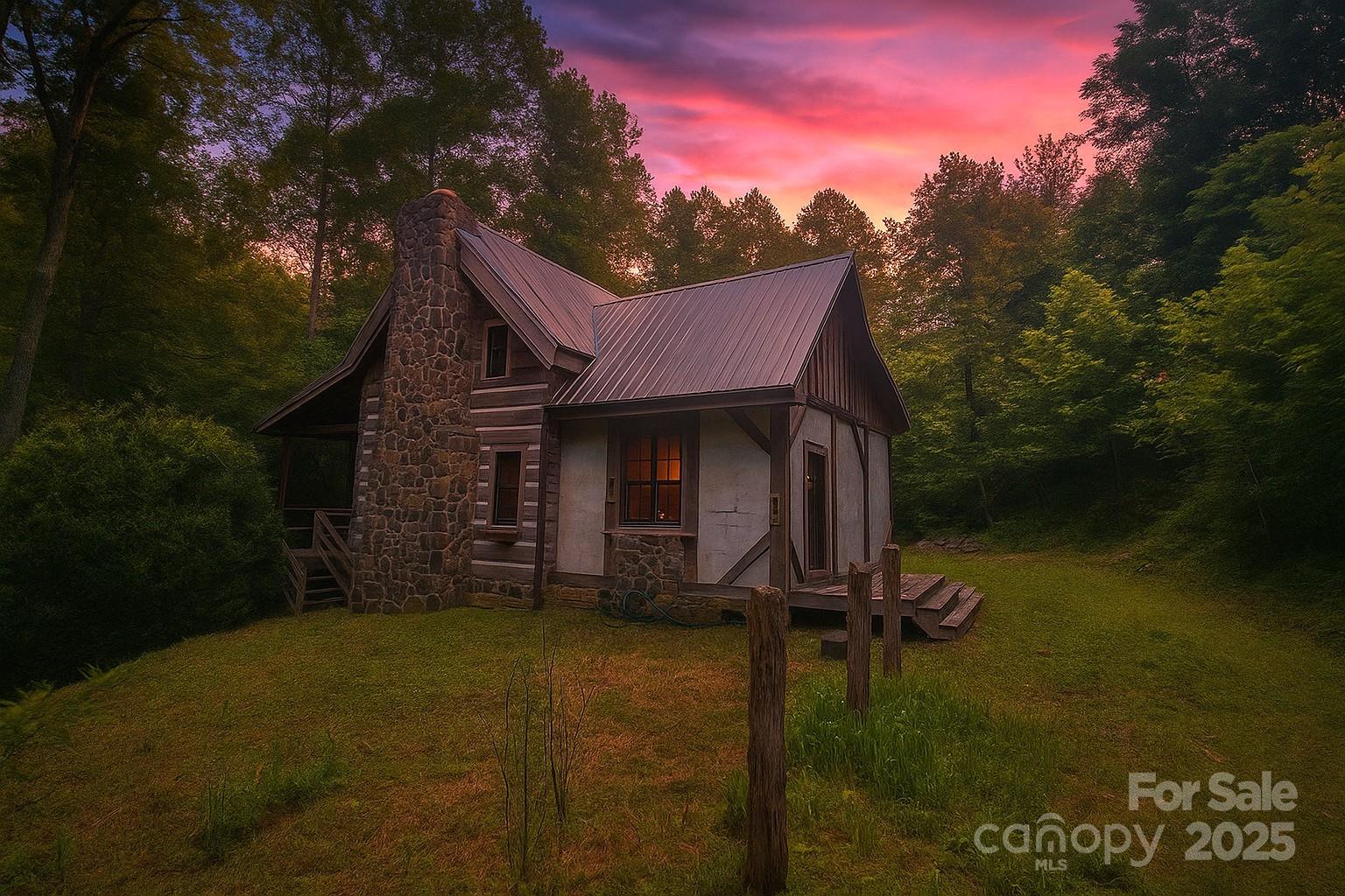 459 Old Yellow Mountain Road Marion, NC 28752 - Photo 1 of 28 a front view of a house with garden