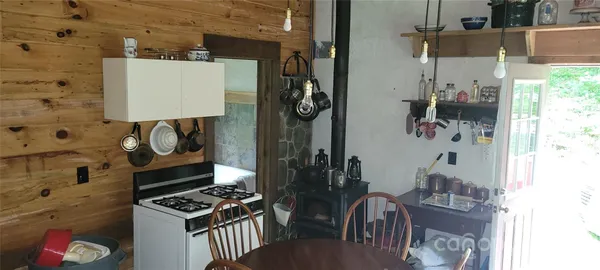 a kitchen with a stove and a microwave