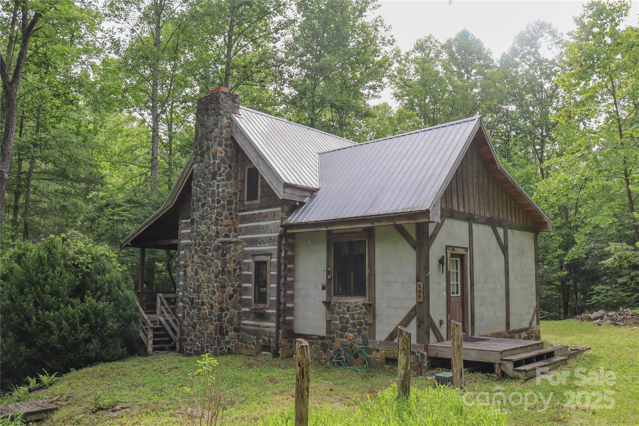459 Old Yellow Mountain Road Marion, NC 28752 - Photo 3 of 28 a view of a house with backyard and trees