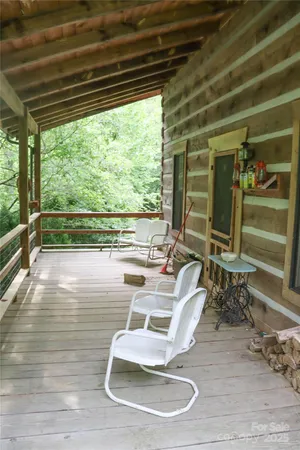 a room with wooden floor table and chairs