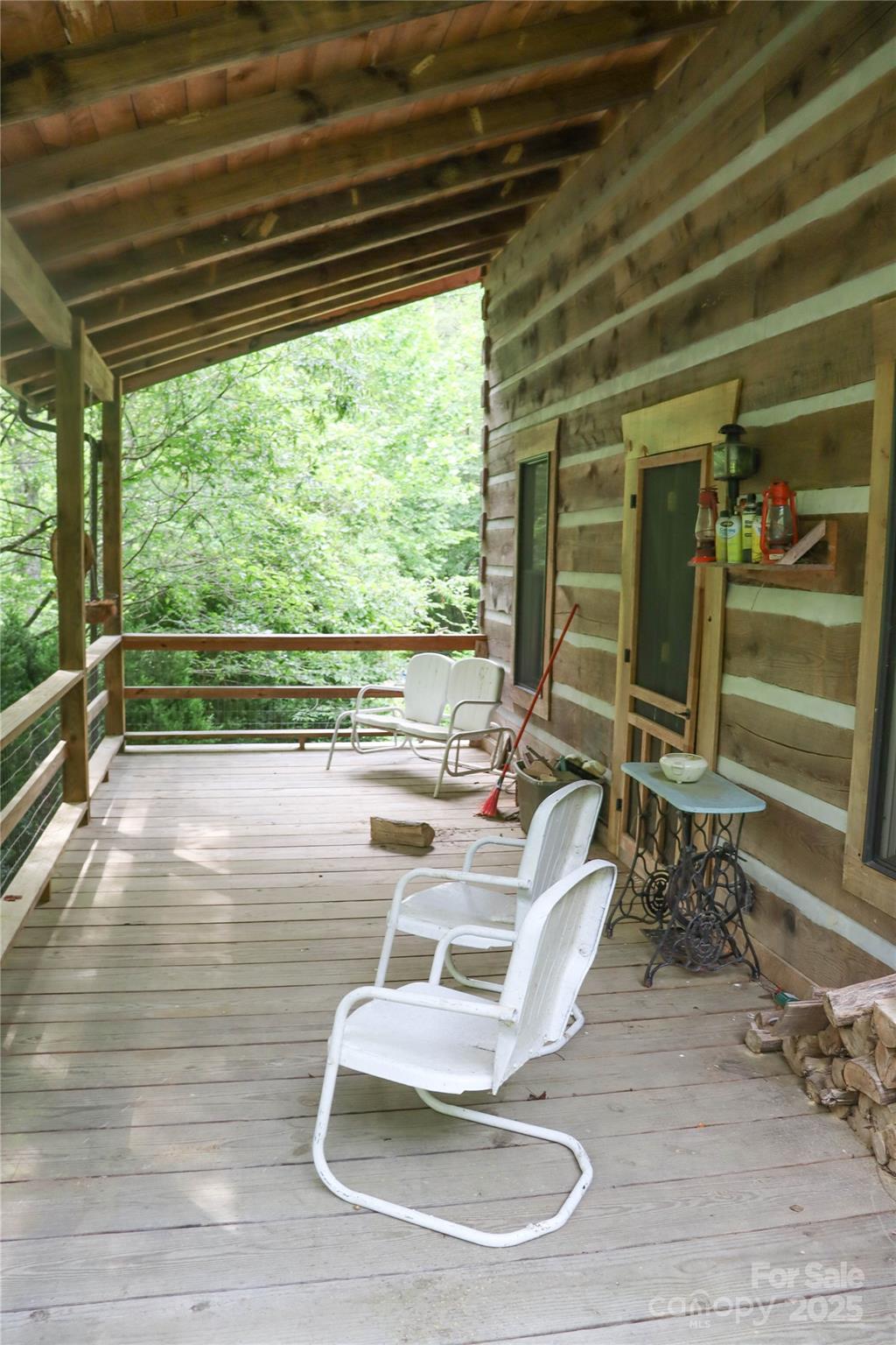 459 Old Yellow Mountain Road Marion, NC 28752 - Photo 8 of 28 a room with wooden floor table and chairs