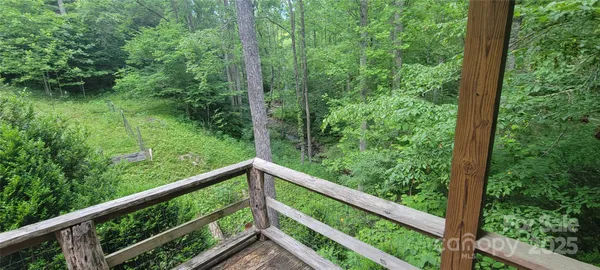 a view of a forest from a balcony