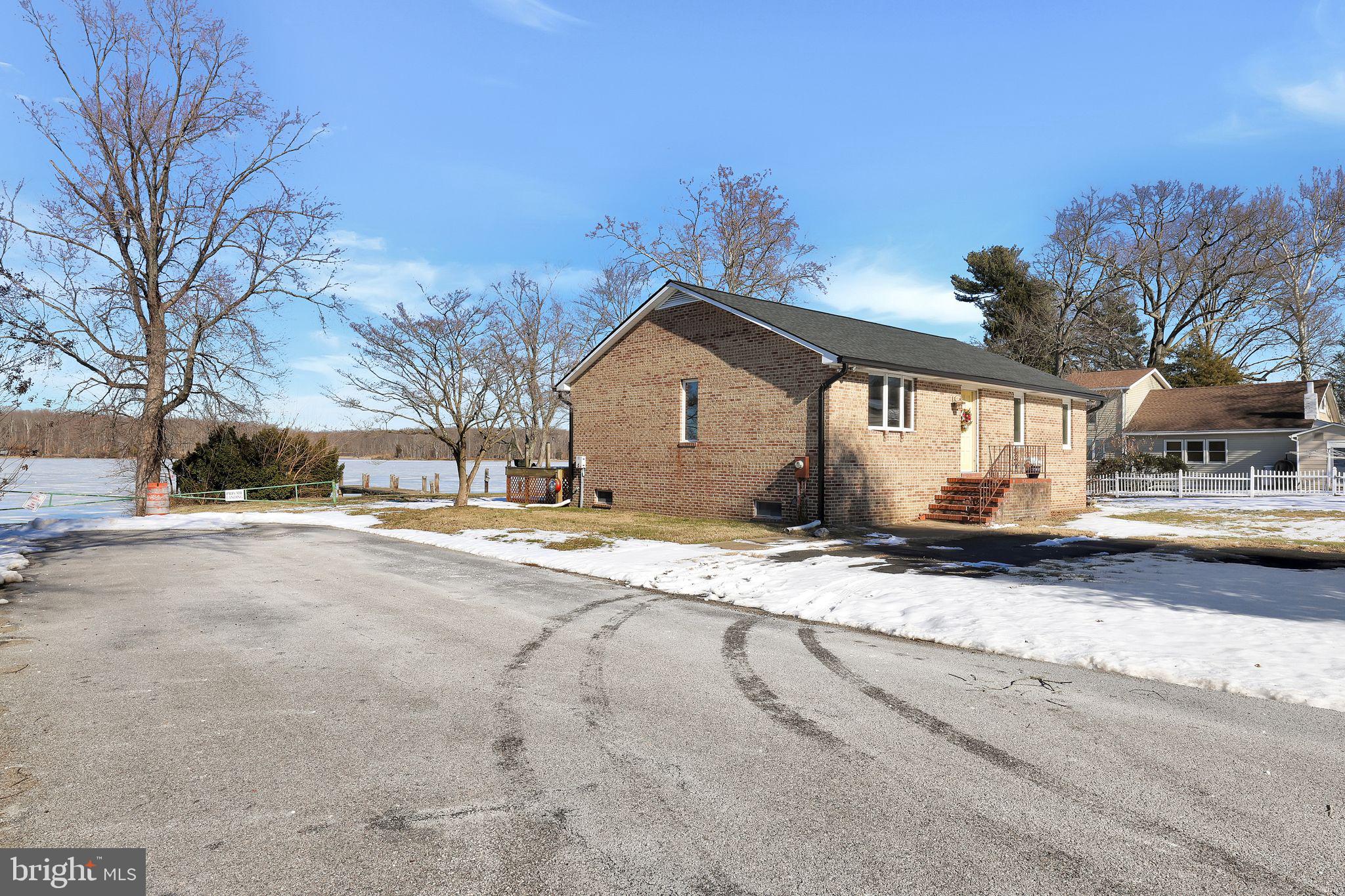 6600 Blackhead Road Baltimore, MD 21220 - Photo 2 of 39 a view of house with a yard covered with snow in front of house