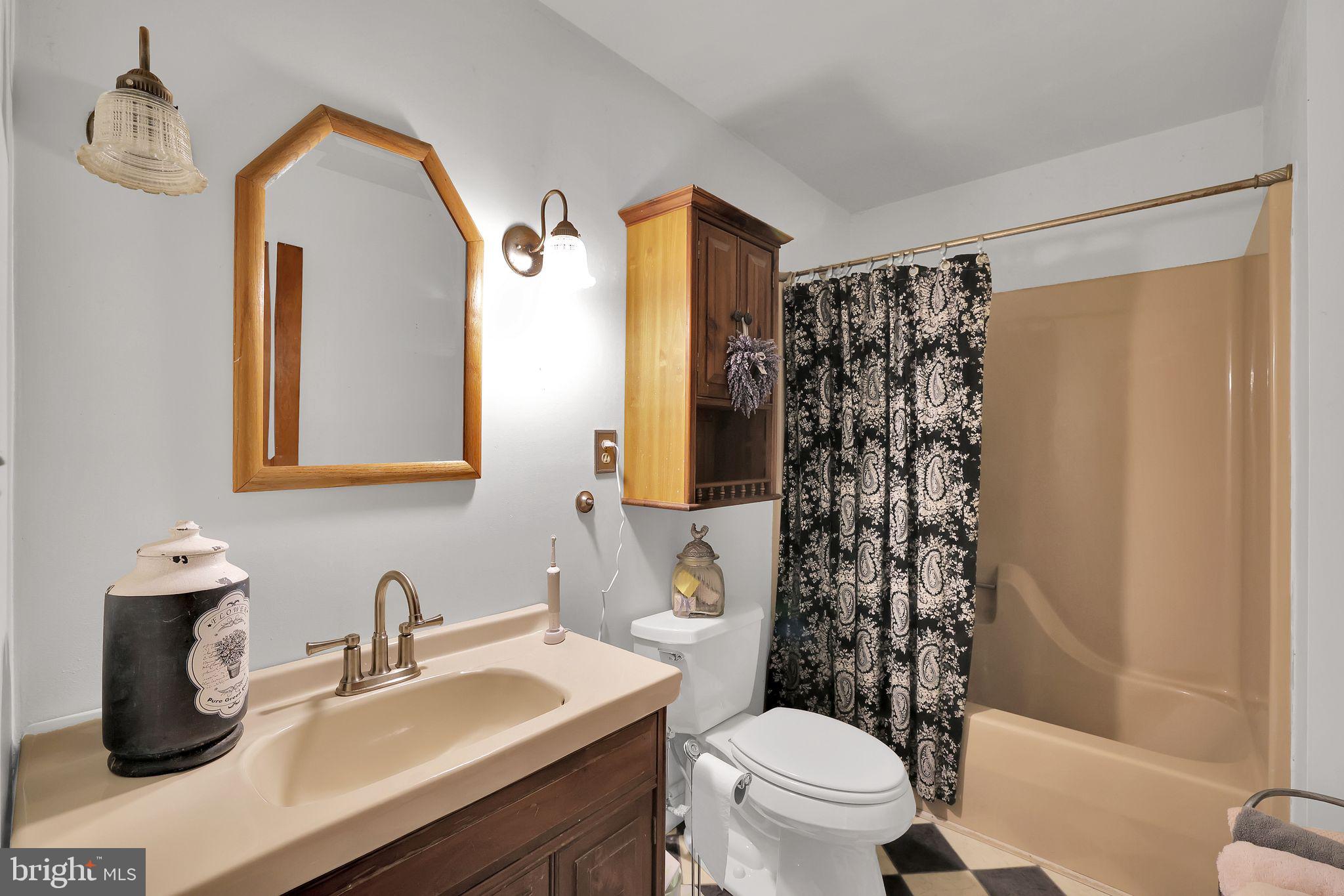 6600 Blackhead Road Baltimore, MD 21220 - Photo 30 of 39 a bathroom with a sink toilet and shower