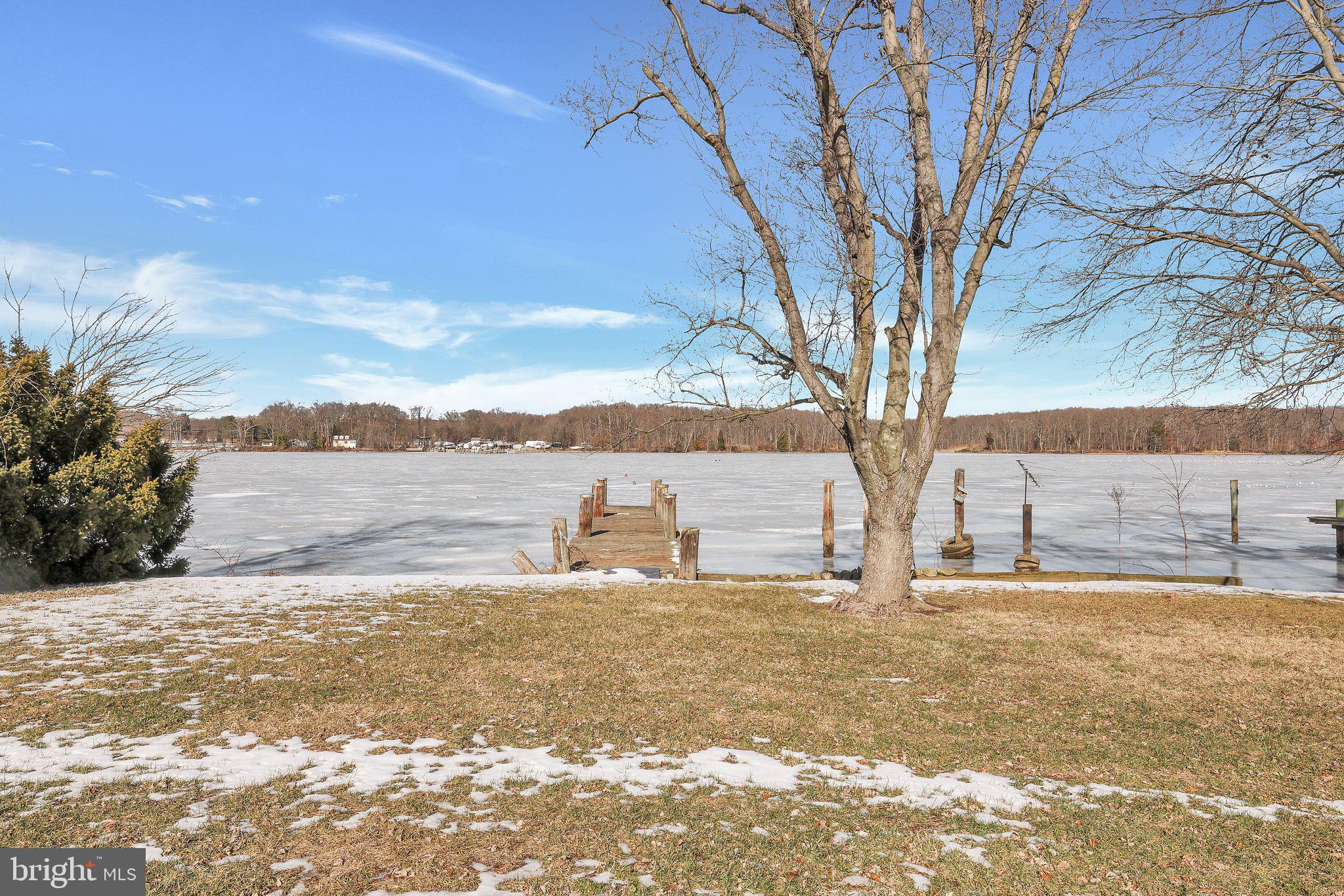 6600 Blackhead Road Baltimore, MD 21220 - Photo 7 of 39 a view of a lake with a tree in the background