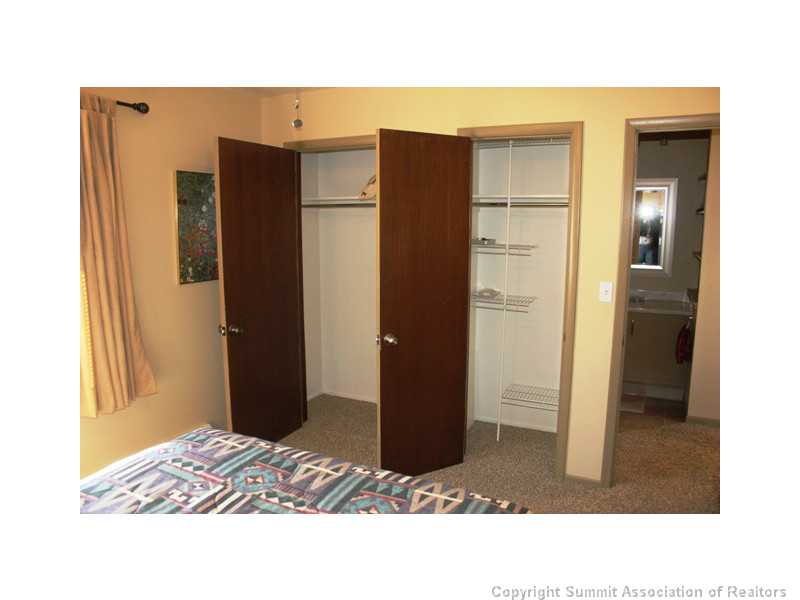70 Evergreen Road, Unit 305 Dillon, CO 80435 - Photo 18 of 21 Bedroom. Double Closets in the bedroom. Right side is a lockable closet