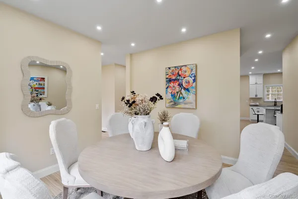 a dining room with furniture and wooden floor