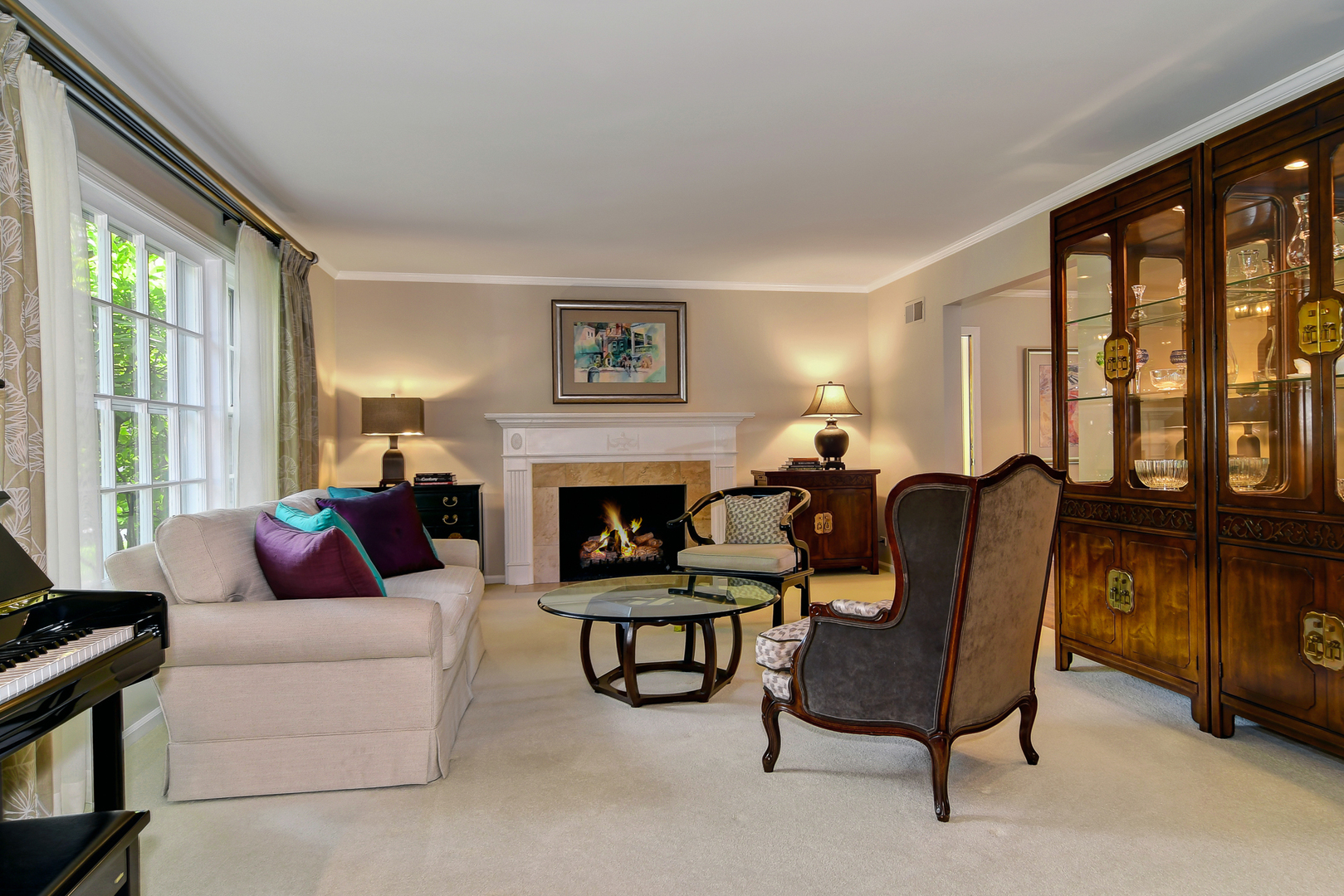 1124 Woodview Road Burr Ridge, IL 60527 - Photo 10 of 27 a living room with furniture and a fireplace