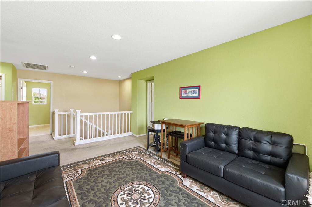 2822 Emerald Lane Lancaster, CA 93535 - Photo 13 of 29 a living room with furniture and a wooden floor