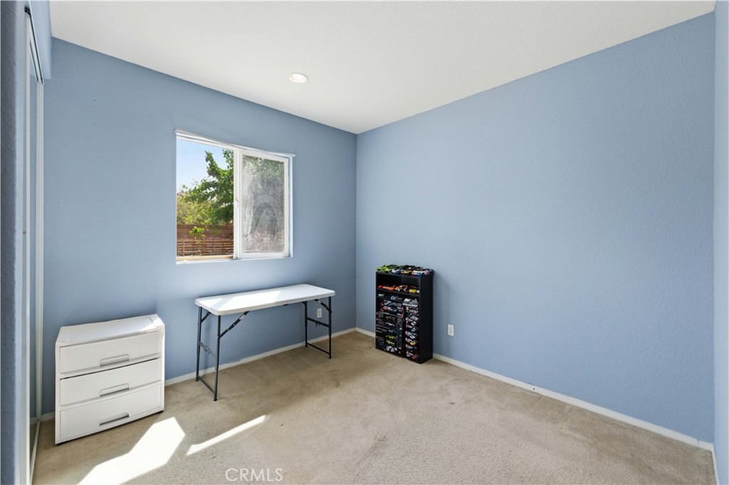 2822 Emerald Lane Lancaster, CA 93535 - Photo 14 of 29 a room with furniture and a window