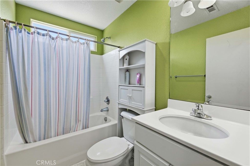 2822 Emerald Lane Lancaster, CA 93535 - Photo 17 of 29 a bathroom with a sink a toilet and shower