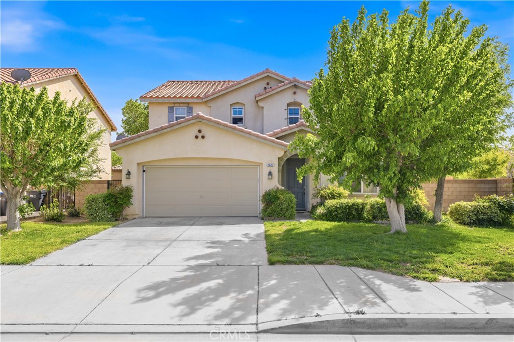 2822 Emerald Lane Lancaster, CA 93535 - Photo 2 of 29 a view of a house with a yard