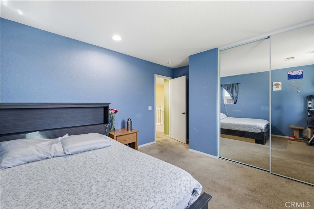 2822 Emerald Lane Lancaster, CA 93535 - Photo 22 of 29 a bedroom with a bed and a lamp