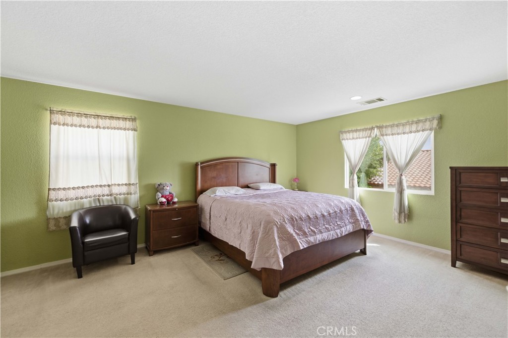 2822 Emerald Lane Lancaster, CA 93535 - Photo 23 of 29 a bedroom with a bed and a window