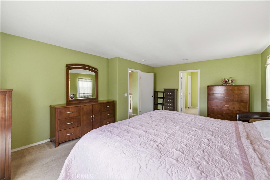 2822 Emerald Lane Lancaster, CA 93535 - Photo 24 of 29 a bedroom with a bed and a dresser in it