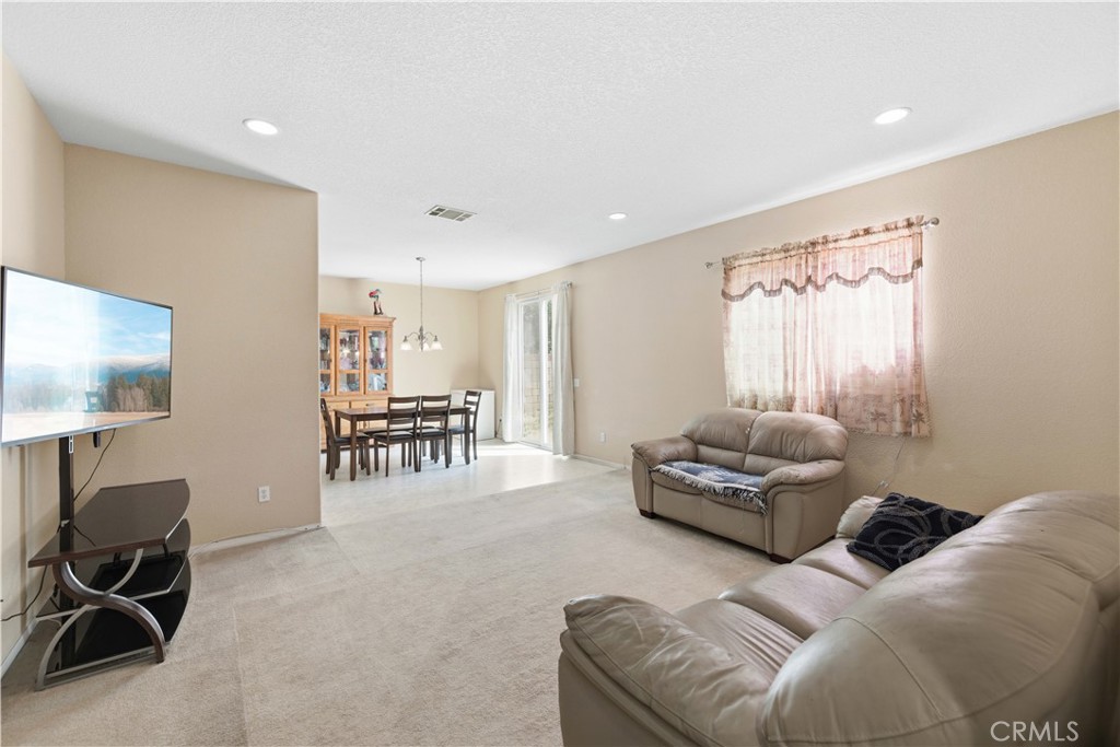 2822 Emerald Lane Lancaster, CA 93535 - Photo 5 of 29 a living room with furniture and a flat screen tv