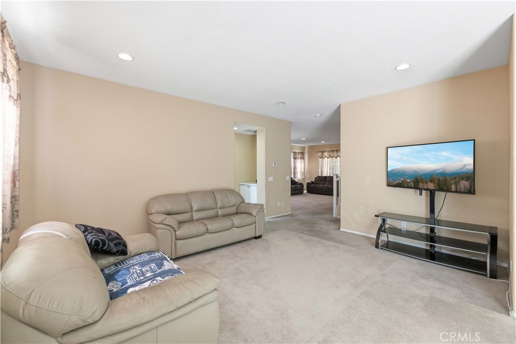 2822 Emerald Lane Lancaster, CA 93535 - Photo 6 of 29 a living room with furniture and a flat screen tv