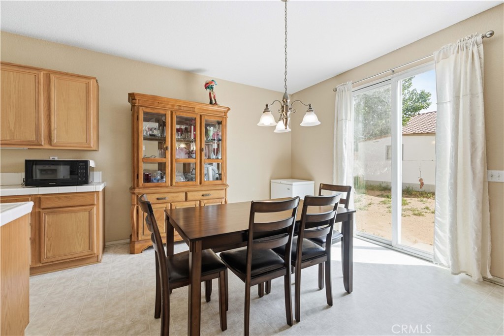 2822 Emerald Lane Lancaster, CA 93535 - Photo 8 of 29 a view of a dining room with furniture window and outside view