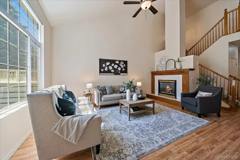 a living room with furniture couches and a fireplace